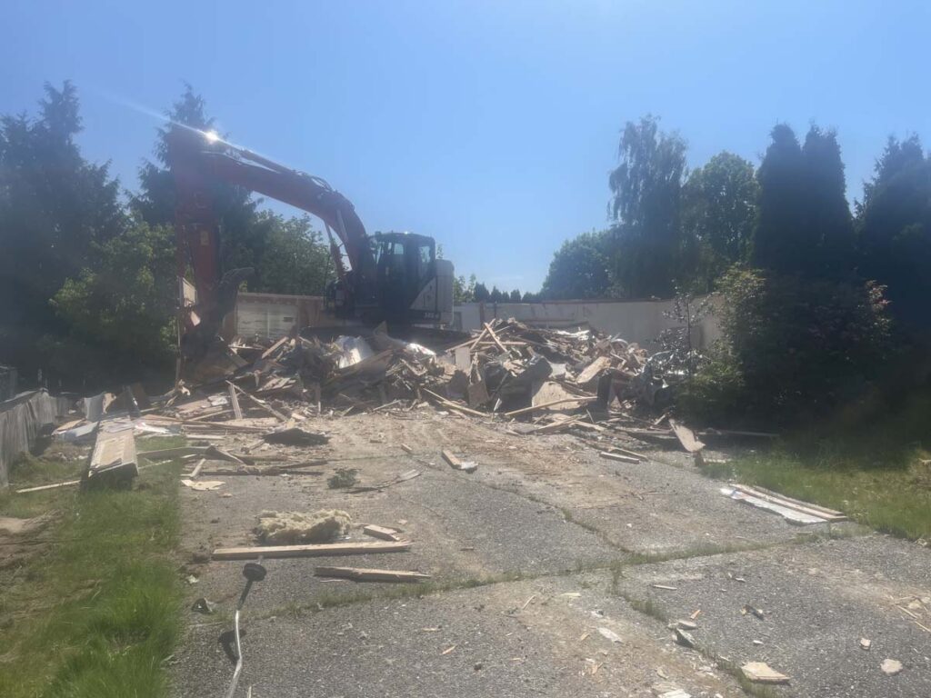 A structure being torn down mid-demolition